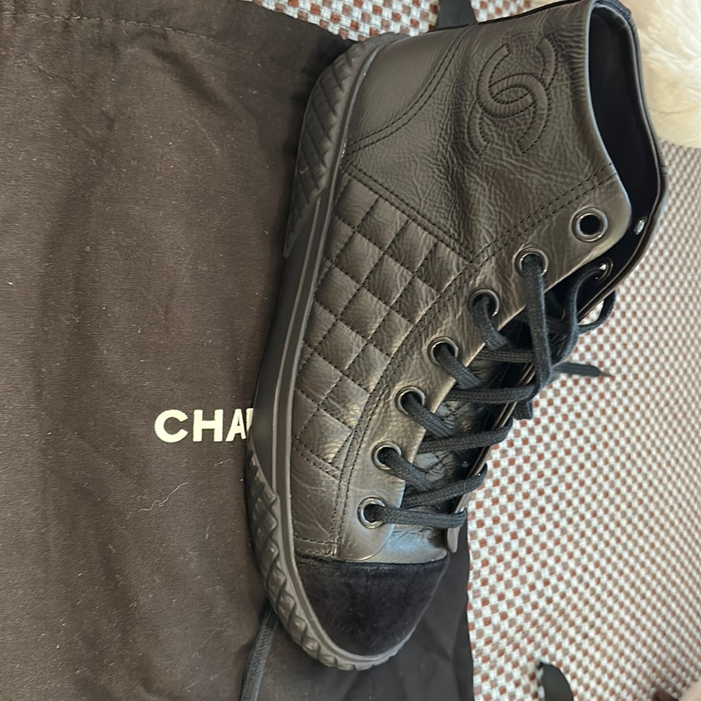 Chanel Quilted High Top Sneakers Captoe CC Logo
. Crafted in Italy.